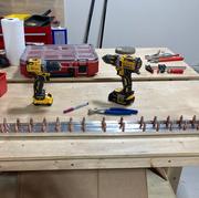 Drilling all of the holes for rear spar and both of the reinforcing bars.